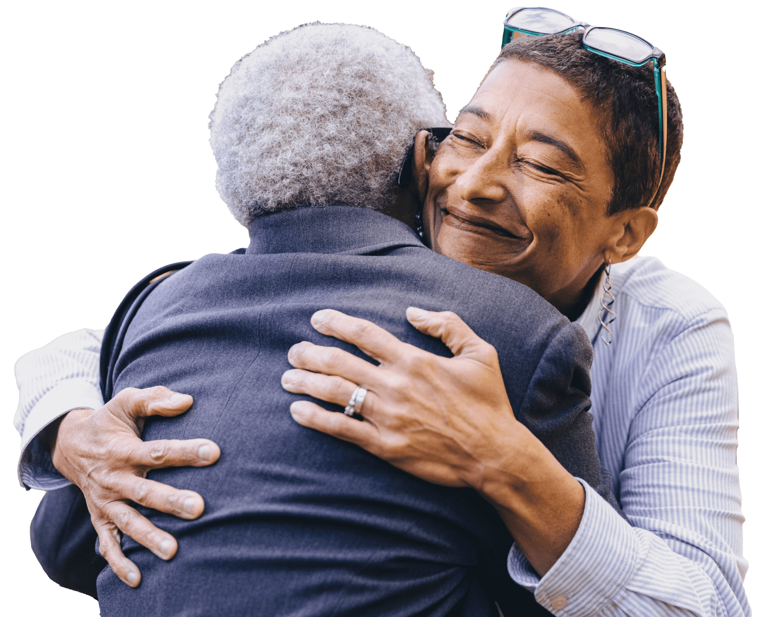 two elder women hugging and smiling